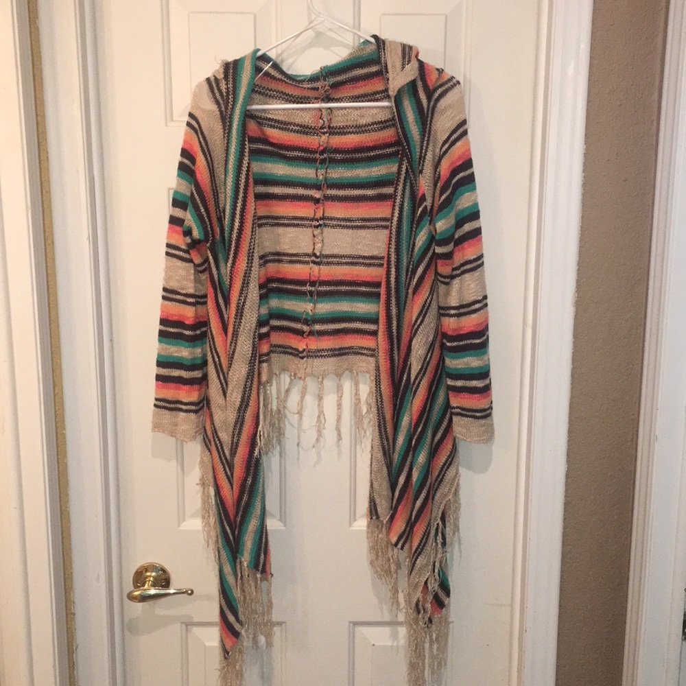 Super cute open fringed poncho style sweater!